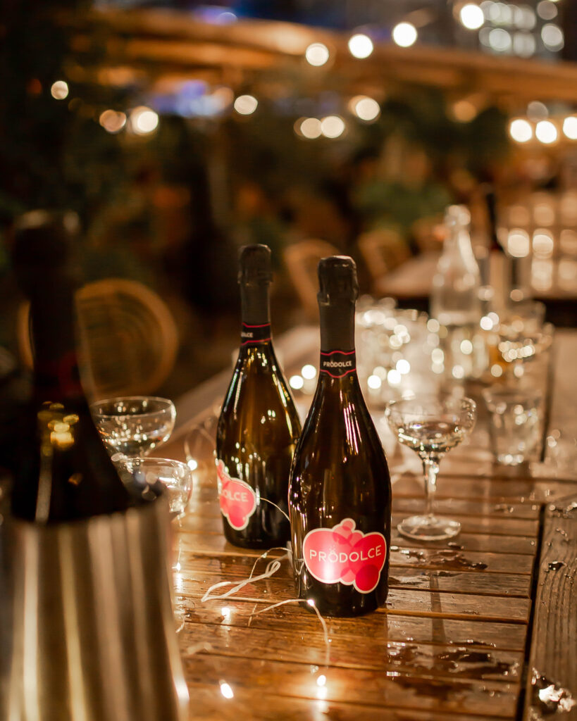 prodolce bottles on table at dinner party