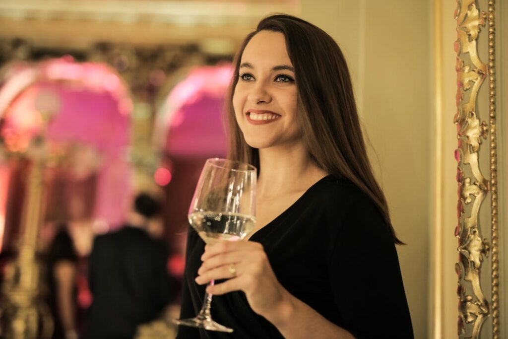 lady holding glass of sparkling wine